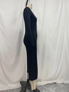 Detail shot of black knitted bodycon dress featuring elegant front button closure