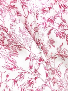 Detail of the high-quality white invisible zipper on the floral tiered summer dress