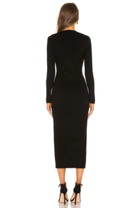 Detail view of the long sleeve black knit dress showing refined ribbed texture from behind