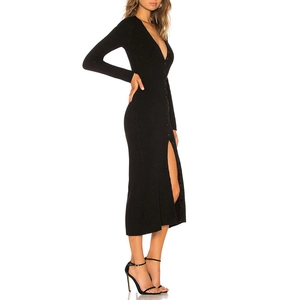 Detailed side view of black ribbed knit dress with V-neckline and high side slit