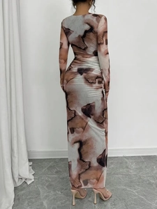 Slim fit long sleeve dress with abstract marble print and floor-length silhouette