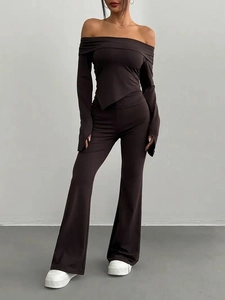 Women's chic solid knit two-piece set featuring off-shoulder top and flared pants