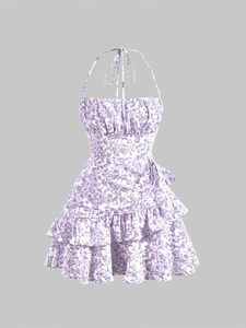 Detail of floral halter dress showing ruffled bodice, drawstring waist and tiered hem