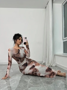 Slim fit long sleeve maxi dress featuring abstract marble print and minimalist round neck
