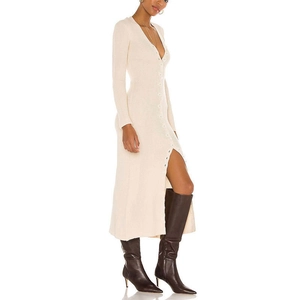 Close-up of the ribbed knit texture and button-up detail on the cream maxi dress