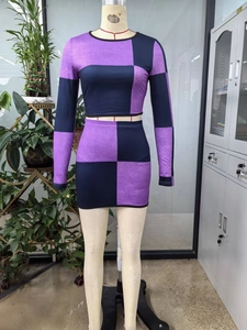 Detailed knit texture of purple and navy checkered crop top and high waist skirt set
