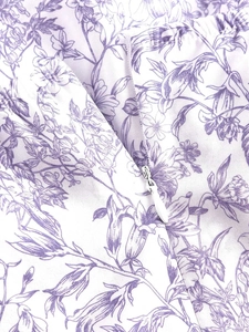 Close-up of invisible zipper detail on purple floral vintage tiered sun dress