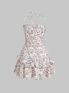 Close-up of floral halter mini dress with double-layered ruffle hem and back zipper