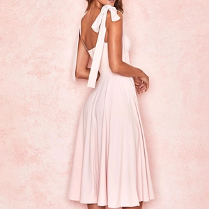 Detailed back view of a pink chiffon dress with backless design and shoulder bow ties