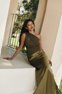 Detail of olive green one-shoulder dress with pleated bodice and satin skirt texture