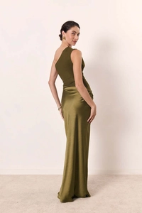 Detail view of olive green dress showing the contrast between knit top and satin skirt fabric