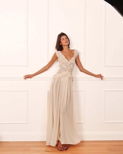 Detail of elegant V-neck lace bodice and pleated waist on flowy chiffon evening dress