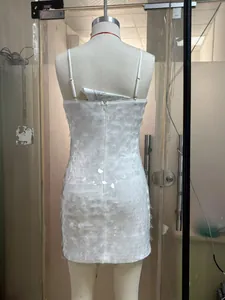 Detail of white sequin dress showing fish scale texture and hidden back zipper