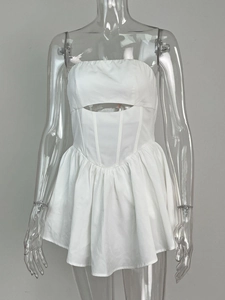 Detailed view of white off-shoulder mini dress featuring cutout waist and pleated skirt