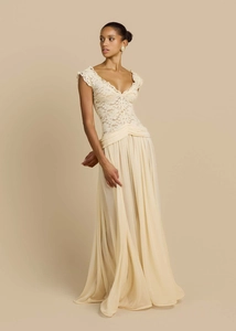 Detail view of the elegant V-neck lace bodice and flowing chiffon skirt on this beige gown