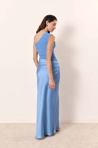 Detailed close-up of sky blue satin dress showing side drape and smooth fabric texture