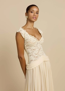 Detail of elegant lace bodice and pleated waist on a chic French-style evening dress