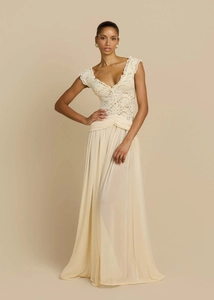 Detailed view of the elegant V-neck lace bodice and pleated chiffon evening dress in beige