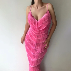 Detail of multi-layered pink fringe and slim-fit silhouette on a sexy V-neck party dress