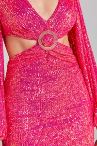 Detailed view of fuchsia sequin dress with waist cut-out and metallic ring detail