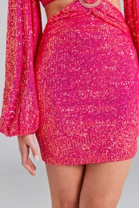 Detail of rose pink sequin dress featuring rhinestone ring buckle and shimmering fabric