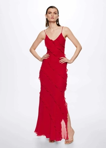 Detail view of red chiffon maxi dress featuring multi-layered ruffles and side slit design