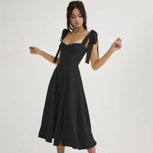 Elegant black A-line midi dress with sweetheart neckline and bow tie straps detail