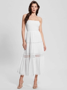 Detailed macro view of white spaghetti strap tiered dress with delicate lace trimmings