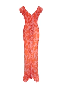 Macro detail of red floral chiffon maxi dress with V-neckline and ruffled edges