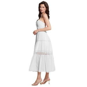 White boho backless midi dress with lace cut-outs and tiered skirt side view