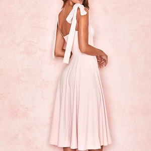 Detail of the elegant pink midi dress featuring tie-up shoulder straps and an A-line silhouette