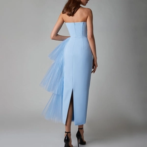 Detailed back view of light blue evening dress with mesh ruffles and invisible zipper