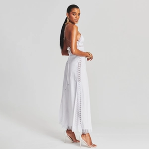 Elegant white lace maxi dress featuring backless design and intricate hollow-out embroidery