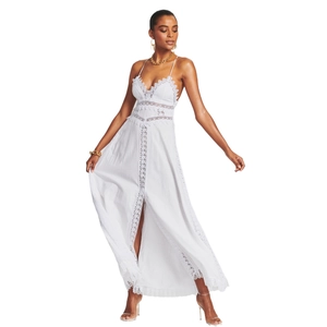 White bohemian lace maxi dress with deep V-neck and delicate hollow out embroidery details