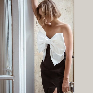 Elegant French style black off-shoulder dress with oversized white bow and side slit