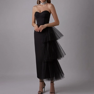 Elegant black strapless evening dress with asymmetrical tiered mesh tutu skirt detail