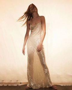 Macro shot of champagne sequin embroidery on the floor-length elegant evening dress