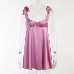 Pink satin camisole dress with bow straps, hollow-out chest detail, and A-line silhouette