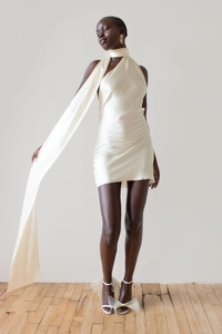 Detail of elegant satin halter neck mini dress with a long flowing neck ribbon