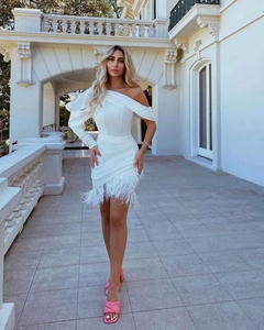 Detail of white one-shoulder mini dress with elegant feather hem and slim fit design