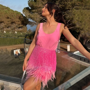 Elegant bright pink two-piece set featuring sequin fringe and feather mini skirt
