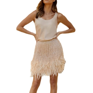 Elegant champagne satin two-piece set featuring sleeveless top and fringe feather mini skirt