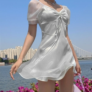 Chic pearl white puff sleeve mini dress with ruched sweetheart neckline on riverside