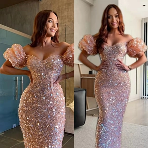 Elegant champagne sequin evening gown with puff sleeves and off-the-shoulder silhouette
