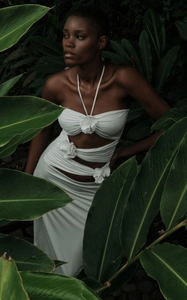 Detail of 3D fabric flowers and sexy cut-outs on white summer halter maxi dress