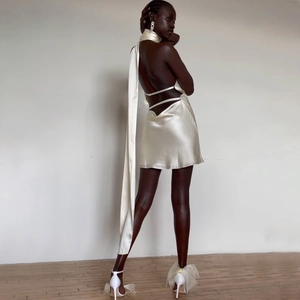Elegant champagne satin backless mini dress with halter neck and long ribbons for women