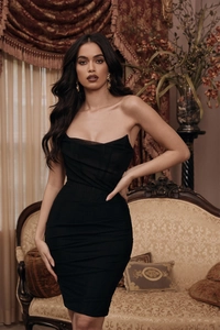 Detailed close-up of the elegant black strapless bodycon dress with ruching textures