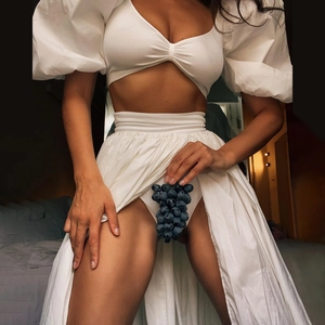 Elegant white two-piece set with puff sleeves and a high-slit maxi skirt for women