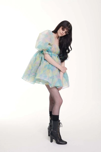 Close-up of pastel puff sleeves and tiered organza texture on vintage floral dress