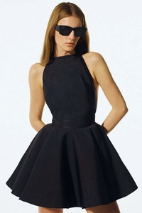 Detail of elegant black halter neck sleeveless A-line dress with waist-slimming silhouette
